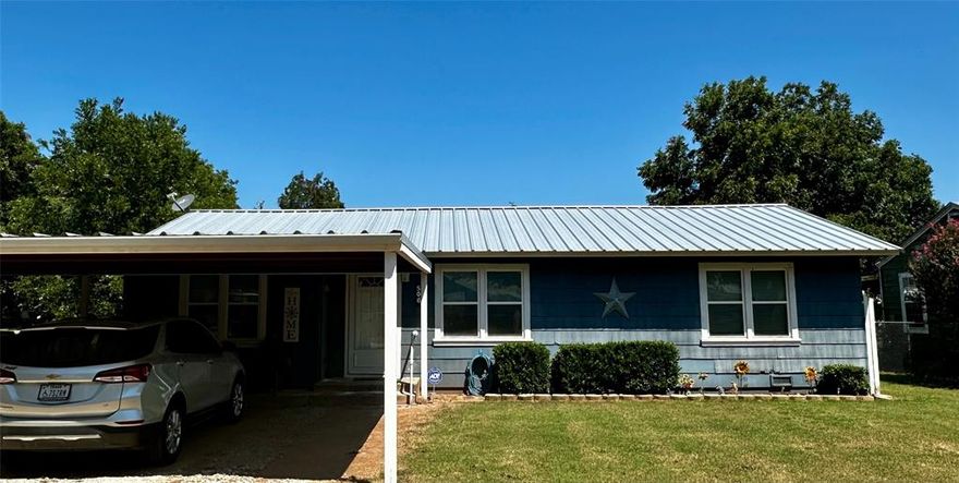 Charming 2 bed, 1 bath home on a half-acre corner lot. Features central heat & air, carport, fenced yard with covered patio, and a workshop. Mature pecan trees provide shade, while the large lot offers room to expand or build. A perfect blend of comfort and possibilities.
