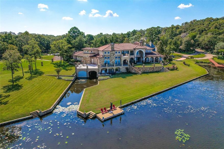 Castello Sul Lago which means Castle on the lake! Exquisite, custom home on just over 2 acres of lake front property & sides the #2 hole of the Cascades championship golf course. Hand painted ceilings ranging from 18-22 ft, imported marble, built in aquarium, executive office with staircase access to private oval library. A dream kitchen with wolf appliances, subzero fridge, double sinks and more. Primary bedroom looks out to the lake through floor to ceiling windows & has private kitchenette. Primary bath has steam shower and soaking tub. Entertain with a wine cellar, open bar with Viking wine fridge, 3 patio areas & multiple guest rooms. Lower level has a private boat house-garage with canal out to the lake.