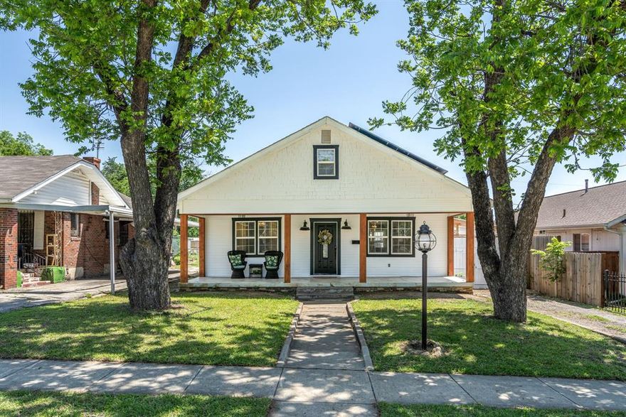 Step back in time while enjoying modern comfort in this beautifully restored 1920s home overlooking downtown Fort Worth. Nestled beneath three majestic 100+ year-old producing pecan trees, this property blends historic charm with sustainable living. The grounds feature two apple trees, a couple pear trees, blackberry and blueberry bushes — a true urban homestead in the heart of the city. A fully metal fenced chicken coop with greenhouse roof, and an expansive 50’x20’ greenhouse outdoor space just outside all of the west-facing windows area makes it ideal for those seeking self-sufficiency without sacrificing convenience. Inside, all major systems have been updated — new plumbing, electrical, and foundation, plus a tankless water heater and all included appliances, even washer and dryer. Original exposed shiplap walls highlight the craftsmanship of the era, while the main bathroom transports you back to the 1920s with its restored clawfoot tub and custom tigerwood vanity — a luxurious nod to vintage design. Whether you’re sipping coffee under the pecans or watching the downtown skyline light up at night, this property captures the rare magic of historic charm meets modern homestead living — right in the heart of Fort Worth.