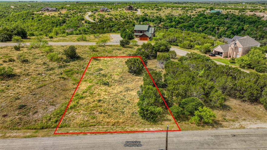 Nestled in a rugged yet level terrain, this homesite in The Cliffs Resort offers an ideal foundation for building your dream home. Embrace the natural beauty and scenic allure of this exclusive community on Possum Kingdom Lake. With no requirement to build within a specific timeframe, you can plan your future home at your own pace. Resort Highlights include, 36 complimentary rounds of golf per year at the 18-hole Championship Golf Course, dining, Marina access, Luxury Accommodations, Recreational Facilities, and so much more! Experience the best of upscale living in this private community, with access to all the wonderful amenities The Cliffs Resort has to offer. This is your opportunity to own a piece of paradise at Possum Kingdom Lake.