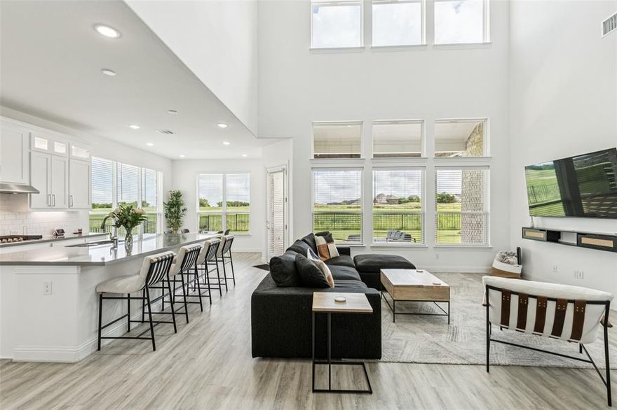 Welcome to this elegant two-story, a beautifully crafted 3,754 sq ft residence designed for both luxurious everyday living and unforgettable entertaining. Set on a prime lot with eye-catching golf course views, this home offers 4 spacious bedrooms, 3.5 bathrooms, a formal dining room, private study, expansive game room, media room, and a 3-car garage—thoughtfully designed to suit modern lifestyles.

Step inside and be greeted by soaring ceilings in the great room and a wall of windows that flood the space with natural light and panoramic views of the greens. The open-concept chef’s kitchen is a dream, featuring a large island with bar seating, a generous walk-in pantry, quartz countertops, and a gas cooktop—all overlooking the great room and casual dining area for effortless entertaining.

The luxurious owner’s suite is tucked away for privacy and includes a spa-inspired bath with split vanities, a soaking tub, separate shower, and a spacious walk-in closet. Upstairs you’ll find three additional bedrooms—each with walk-in closets—a versatile game room, and a dedicated media room perfect for movie nights or watching the big game.

But the crown jewel of this home is the newly added outdoor living and kitchen area, complete with a built-in grill, prep station, beverage fridge, mounted TV, and covered patio seating—ideal for relaxing evenings or hosting gatherings under the Texas sky. Whether you're grilling with friends or enjoying a quiet morning coffee, this backyard oasis was made for year-round enjoyment.

Located in the resort-style community of Heath Golf & Yacht Club, residents enjoy exclusive amenities including a lakeside clubhouse, restaurant & bar, tennis courts, resort-style pool, boat slips, walking trails, and a private 18-hole championship golf course on the shores of Lake Ray Hubbard.

Come experience elevated living at its finest—this home is the perfect blend of comfort, elegance, and resort-style luxury.