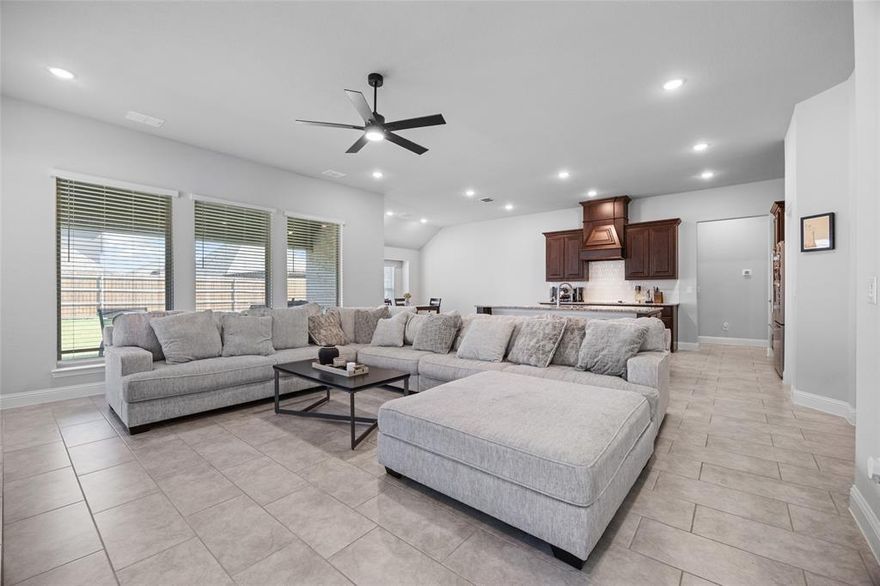 This Home will make you want to stop scrolling after you see the Oversized Utility Room and Flexible Media Space. Situated in The Oasis at North Grove, this single-story Bloomfield design offers 2,527 sq. ft. of open and functional living. The kitchen features granite countertops, stainless steel appliances, a large island with sink, and a walk-in pantry, flowing seamlessly into the spacious living area with natural light. The utility room is oversized, providing space for storage, laundry, or even a second fridge. A dedicated flex space media room offers versatility for a playroom, movie nights, or a private office. The primary suite includes dual vanities, soaking tub, separate shower, and a walk-in closet with laundry access. Two additional bedrooms and 2.5 baths complete the layout. Enjoy a covered patio, fenced backyard, and community amenities like clubhouse, trails, playgrounds, and pool—all within Waxahachie ISD and convenient to shopping and dining.