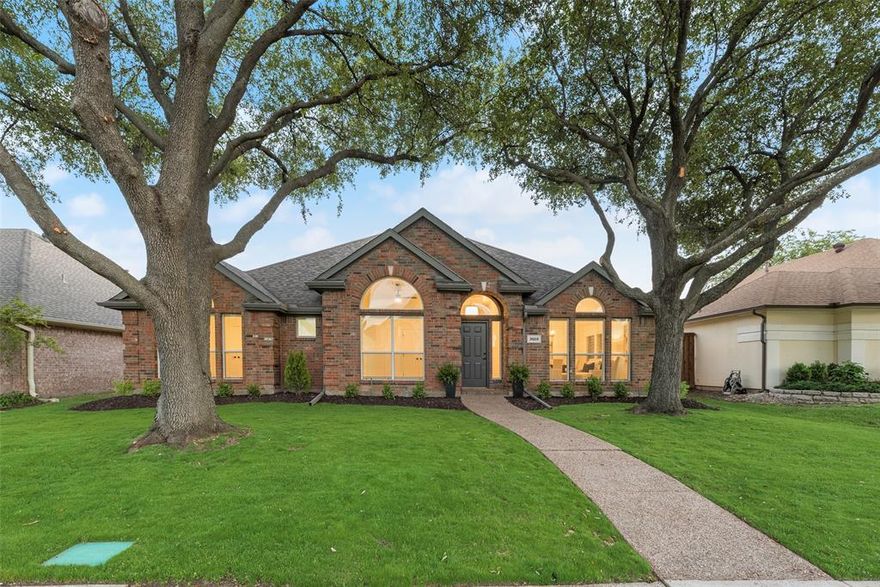 Please submit Highest and Best Offer by Sunday at 5pm. Gorgeously updated 4 bedroom, 3 bath home nestled under large shade trees in desirable North Dallas with Carrollton ISD schools. This property has been completely renovated and is move in ready. Updates include fresh paint throughout, all flooring, countertops, lighting, trim and more!
Flexible formal living areas off the foyer are designed for special occasions and entertaining guests. The chef’s kitchen is bathed in natural light from the large skylight overhead. The kitchen features beautiful quartz counters with painted shaker cabinets, a full pantry, island, breakfast bar and built in stainless appliances. Attached is a breakfast nook with exterior door to the covered patio. The large family room boasts a lovely corner fireplace with cast stone surround and large picture windows out to the back yard. The primary suite has space for a sitting area and includes a large spa like en suite bath with dual sinks and soaking tub as well as a huge walk in closet. Three primary bedrooms downstairs are split from the primary suite and feature fresh carpet and ceiling fans. All bathrooms have been updated with fresh fixtures, floors and vanities. Spacious second floor game room with full bath would make a great playroom or office and could be utilized as a 5th bedroom. The fenced backyard is fully grassed with a big shade tree in the center of the yard and has a covered patio just off the breakfast room. Located in a quiet neighborhood within walking distance to Timberglen Park, Timberglen Library and the elementary school. Just a mile off both George Bush Turnpike & the Dallas North Tollway which gives you quick and easy access around DFW for work & fun!