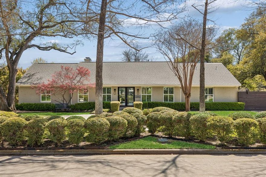 Thoughtfully updated and positioned on a quiet circle drive, this 4,576-square-foot Preston Hollow Ranch offers refined living with exceptional privacy and scale. The home features 4 bedrooms and 4.5 baths with a well-balanced layout designed for both everyday living and effortless entertaining. A custom iron front door opens to formal living and dining spaces, while the heart of the home unfolds into an expansive kitchen and skylight-filled family room overlooking the backyard. Large windows throughout provide abundant natural light and a seamless indoor-outdoor connection. The backyard is designed for year-round enjoyment, featuring a pool, multiple deck and patio areas, and professionally landscaped grounds offering both openness and privacy. The primary suite serves as a private retreat with generous closets, custom built-ins, and a spa-like marble bath. A third living area with custom cabinetry offers flexible use as a media room, additional lounge, or work-from-home space, with direct access to a private office, utility room, and fourth bedroom with en-suite bath—ideal for guests or multigenerational living. With its thoughtful updates, versatile floor plan, and desirable Preston Hollow location near Northaven Trail, this home presents an exceptional opportunity in one of Dallas’ most established neighborhoods.