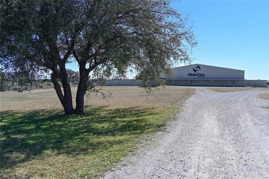 20,000 square foot manufacturing facility with offices on 9 acres MOL. Secondary 4,700 square foot facility. No zoning or deed restrictions. Metal buildings with centralized heat and air. Slab foundations. Gorgeous setting. High fenced with razor wire security and electric gates. Septic, water, fiber already installed. Manufactured 4 bedroom 2 bath home on property. 31 adjoining acres available with three rented manufactured homes generating income available for an additional price. Additional 180 acre lake property also available as separate listing. Note, no interior photos due to no electricity on at the moment. Stained concrete and tile flooring through office areas, kitchen, meeting space, reception area, multiple worker cubicles, restrooms, and showers. Massive safe stays. Above ground fuel barn on site as well. Come see this exceptional industrial, warehouse, manufacturing facility.