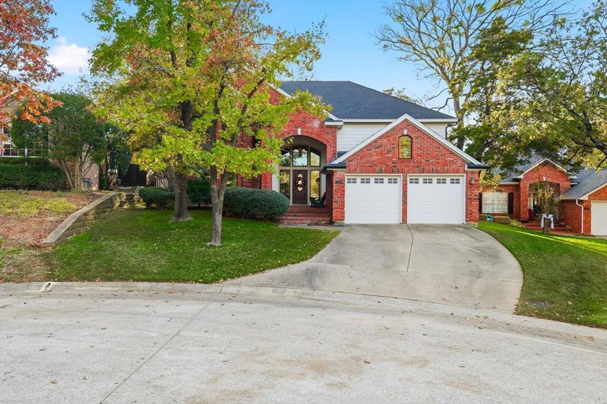 So much to love here! Nestled on a cul-de-sac across from a scenic, tree-lined creek greenbelt in the heart of Highland Shores, you’re just a short walk from top-rated McAuliffe Elementary, Kids Castle, ballfields, three community pools, fitness trails, and tennis-pickleball courts. This sought-after David Weekley Chamberlain floor plan boasts a stunning kitchen remodel perfect for entertaining—featuring a 5' x 6' prep island with breakfast bar, extra storage, Quartz countertops, all-new shaker cabinets, stylish floating shelves, GE Profile stainless steel appliances with induction cooktop, a farmhouse sink with apron front, and a wine bar with beverage fridge. Gorgeous light oak wide plank wood flooring flows throughout both levels and the staircase, accented by tasteful finishes, light neutrals, and decorative lighting. Energy-efficient triple-paned picture windows and two TRANE HVAC units keep the home comfortable year-round. The private, park-like backyard offers mature trees, flagstone patios, lush landscaping, and a cedar privacy fence. Centrally located Highland Village community minutes north of DFW International airport, on the southwest shores of Lake Lewisville with boat dock and marina access, nearby shopping, dining, youth sports, and worship facilities!  Financing Pre-Approval or Proof of Funds is required with all offers.