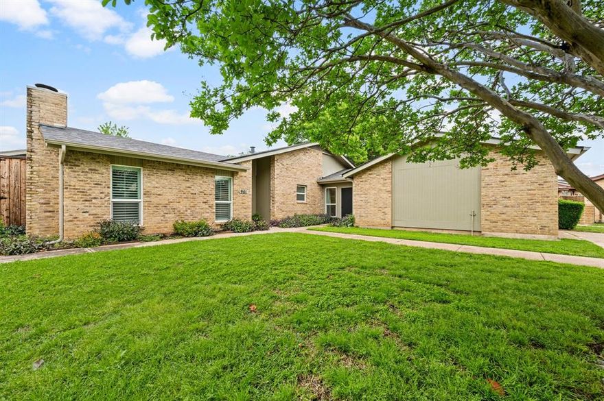 This charming Bedford home blends warmth, character, and a low-maintenance, lock-and-leave lifestyle. Set on one of the largest lots in the community, you’ll appreciate the added space—plus the convenience of HOA-maintained front yard care. Inside, you’re welcomed by a spacious living room featuring vaulted ceilings, plantation shutters, a cozy wood-burning fireplace, and easy access to one of the backyard entertaining areas. The kitchen and dining space offer both comfort and functionality, with stainless steel appliances, ample prep space, and a generous breakfast bar—perfect for everyday living or hosting guests. The primary suite serves as a peaceful retreat, complete with an en suite bathroom and walk-in closet. Two additional bedrooms are generously sized and also include walk-in closets. An enclosed breezeway adds versatile bonus space—ideal for a home office, workout area, or playroom. Recent updates include a brand-new HVAC system and updated windows, while the backyard showcases a beautiful pergola—perfect for relaxing or entertaining. Located in the heart of Bedford, you’re just minutes from parks, shopping, dining, major highways, and DFW Airport. This rare single-story townhome offers the perfect balance of simplicity, comfort, and space.