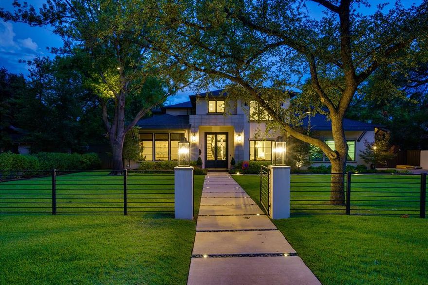 Take a step inside this stunning Preston Hollow soft contemporary to experience top notch luxury Dallas living. Once inside, you are greeted with soaring ceilings, a winding iron staircase, and open concept floor plan as well as an abundance of natural light. The expansive two story living room with wet bar and wine storage opens to a chef's kitchen, featuring a commercial grade range, two dishwashers, oversized island, and walk in pantry. First level primary bedroom is located off the pool, offering a spa like ambiance, complete with a sitting area and fireplace, primary ensuite bath featuring a marble tiled steam shower, jetted tub, separate vanities and toilets. Upstairs bonus room complete with wet bar, ensuite bath, and recent expansion. $800k+ updates include custom iron driveway and front yard gates, sports court, pool and spa, Crestron and security system, mosquito misters, water leak detection system, outdoor kitchen, and landscaping. Centrally located, unbeatable location.
