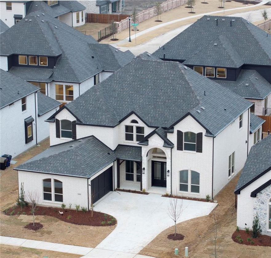 Welcome to this spectacular new construction home in Frisco featuring 6 spacious bedrooms and 4 luxurious bathrooms, blending modern elegance with exquisite design. Built to showcase stunning architecture, maximize space, and utilize abundant natural light, this home boasts soaring ceilings, expansive walls of windows, and a sleek fireplace—offering major wow factor at every turn. A grand spiral staircase draws the eye from every angle. At the heart of the home is a chef’s dream kitchen with gorgeous quartz waterfall countertops, custom hood, kitchen island, pantry, ceiling-height glass cabinets, and much more! The serene primary suite includes a wall of windows, walk-in closets, and a spa-like bath with freestanding tub. The media room is pre-wired for 7.1 surround sound. Enjoy a spacious backyard, open floorplan, upgraded lighting, cable TV wiring, and wired sound throughout this move-in ready masterpiece. Don’t miss the opportunity to make this stunning home yours—schedule a showing today!