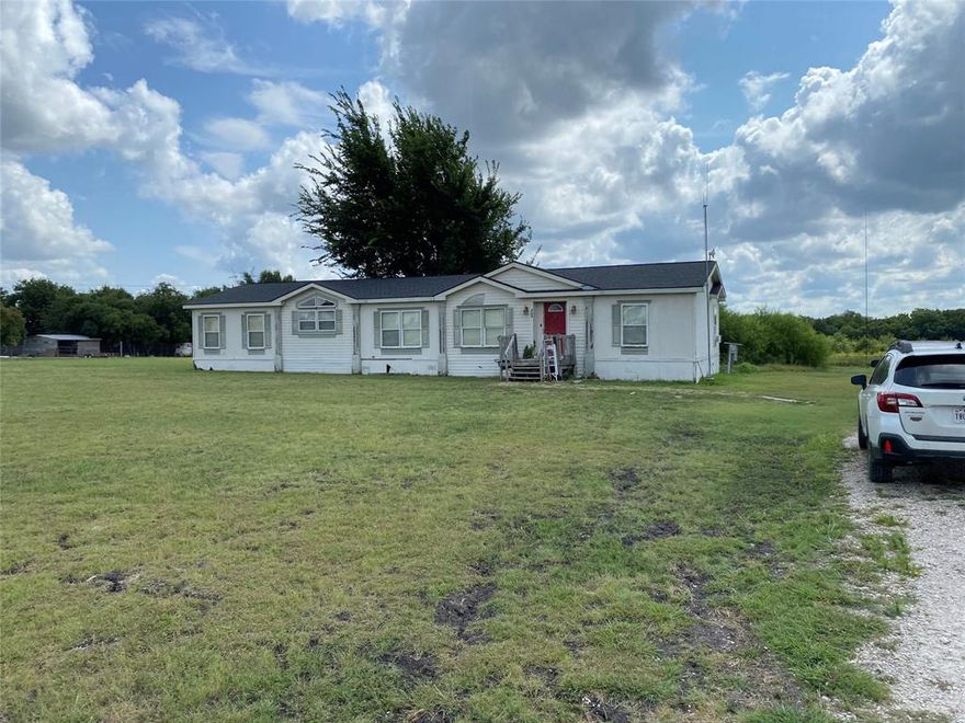 This 10.56 acre property provides a potential buyer with several opportunities. Located within the Farmersville school district you could take this peaceful country setting, put in some work on the existing home and move in. You could use your own piece of the country and build your own dream home or a trendy barndominium. The current residents have a deer feeder set up in a clearing, and enjoy their time watching wildlife coming and going throughout the property. This tract of land is located within walking distance of the popular Chaparral Trail, perfect for a long hike or place to get away.  And if building isn't your dream, this property also presents a great investment opportunity, as larger tracts of land close to the Metroplex are becoming increasingly scarce. Also listed under MLS #20945111.
