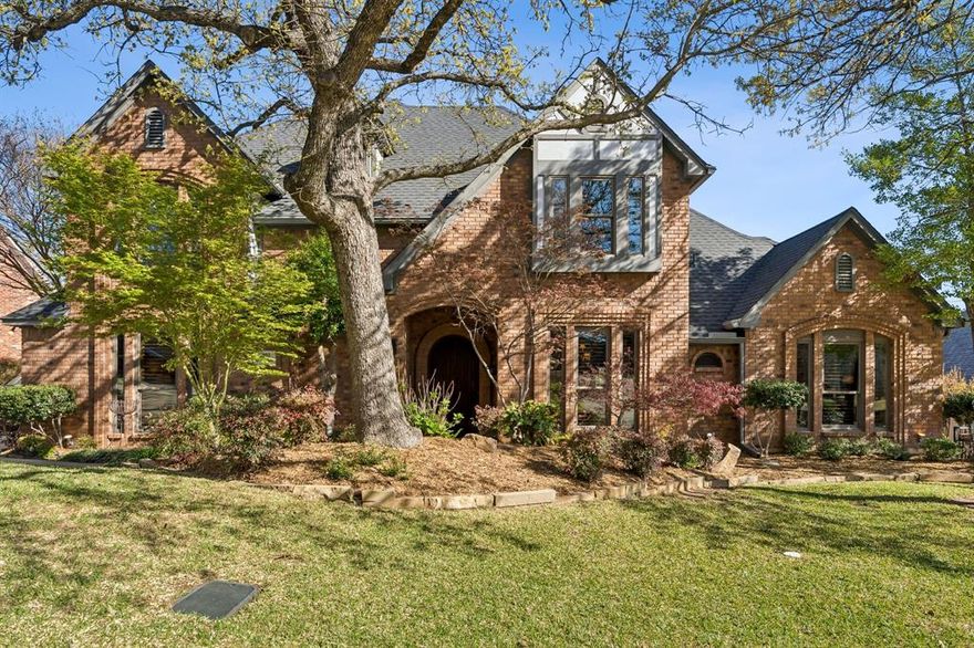 Situated on a quiet, tree-lined lot backing to a greenbelt, this highly custom 4-bedroom, 3 full bath two-story home offers exceptional craftsmanship, functional design, and long-term value. The exterior showcases mature landscaping, an electric gate for secured driveway access, and a private backyard retreat featuring a swimming pool with dual waterfall features. Inside, the home is defined by extensive wood trim, detailed molding, and a striking exotic custom front door that sets the tone upon entry. The well-designed floorplan includes two bedrooms on the first level, ideal for multigenerational living or guest accommodations, along with two dining areas and three spacious living areas. A dramatic main living space features soaring ceilings, exposed wood beams, and abundant natural light. The kitchen is appointed with granite countertops, custom cabinetry, stainless steel appliances, and a functional layout that opens to the main living areas. Hardwood flooring extends throughout the first floor, with tile in all wet areas for durability. The primary suite and secondary baths have been thoughtfully updated, offering modern finishes and a spa-like feel. Additional highlights include a full irrigation system and French drains to maintain optimal soil moisture, foundation stabilization completed in 2024 with a transferable warranty, and a new roof installed in December 2025. This all-electric home has been meticulously maintained and reflects pride of ownership throughout.