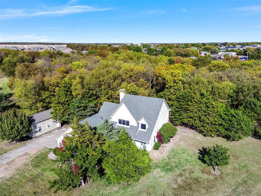 A Hidden Slice of Paradise on 2.42 Acres! 3 Bed, 2 Bath with Separate Apartment and beautiful mature trees!
Discover a rare opportunity to own a property that feels like a private retreat while still being close to all the conveniences of the city. Tucked away behind a long driveway and surrounded by mature trees, this captivating home greets you with charming stone-front architecture and unforgettable drive-up appeal!
Inside, the home features fresh paint throughout and thoughtful upgrades. The spacious living room is anchored by a beautiful stone fireplace, creating the perfect gathering space for cozy winter evenings. Natural light filters in through every window!
The kitchen has been tastefully updated with new granite countertops, a new built-in flat-top range, and under-cabinet lighting. Whether preparing everyday meals or hosting friends and family, this space blends modern convenience with rustic charm.
Upstairs, the primary bedroom offers a peaceful retreat with direct access to a private sundeck overlooking the stunning backyard. It's the ideal setting for morning coffee, evening relaxation, or simply taking in the views.
Unique touches continue throughout the home, including a charming window on the stair landing so your pups can enjoy looking outside! Plus, the remodeled bathroom includes a vessel sink and a beautifully tiled slate shower that adds a luxurious, spa-like feel.
Outside, the property is magical. A deck extends along the back, providing the perfect space for outdoor living. Beyond the deck, a creek runs through the back of the property. The acreage is dotted with mature trees, offering shade, privacy, and the feeling of being worlds away from city life.
The land also includes a covered shed, chicken coop, animal pen, and a custom-built playhouse. A separate building sits on the property as well with a full bathroom, ideal for extended family, guests, or use as a private office or studio.