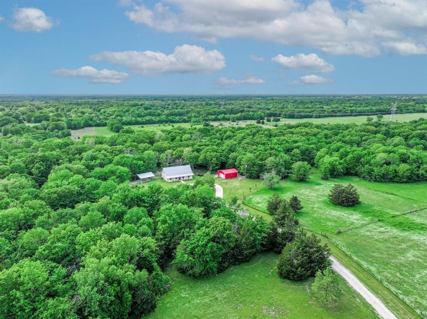 **Motivated Seller** Priced Below Appraised Value - Come and see this fully renovated home featuring 4 spacious bedrooms and 3 full baths nestled on 50 peaceful acres. This open concept two story home is beautifully secluded, surrounded by mature trees and multiple pastures. Interior features include luxury vinyl flooring throughout, gas fireplace, vaulted shiplap ceilings, and a kitchen perfect for the family chef with updated stainless steel appliances, gas range, quartz countertops, and custom cabinets. Outside you’ll find large front and back covered porches, 2 stocked ponds, backyard fire pit, spacious carport and newly finished concrete circle drive. A large shop with electricity can be used for hobbies and storage, and also features a separate 1 bedroom 1 bath living quarters with kitchenette, perfect for in-laws, guests or potential rental income. There is an additional storage building and covered tractor and trailer parking. Property is Ag exempt, fenced and cross fenced with plenty of extra land for hunting or agriculture. Serene country living minutes from I-30 and downtown Sulphur Springs. Schedule your showing today!