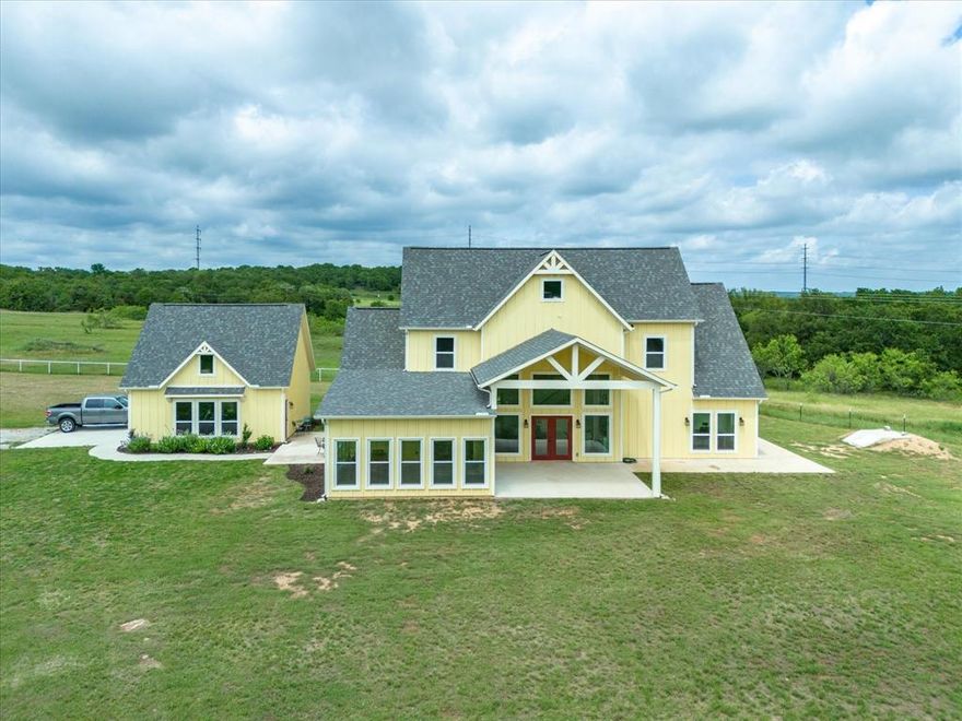 Discover country living at its finest in this exquisite 4-bedroom, 3-bathroom craftsman style home nestled on 5 acres of picturesque land in Sunset, TX. This stunning home boasts an abundance of natural light, tall ceilings, and exposed beams in the living room and kitchen, creating a warm and inviting atmosphere. The chef's kitchen features quartz countertops, stainless steel appliances, custom-built cabinets, and a walk-in pantry, perfect for culinary enthusiasts. Retreat to the primary bedroom downstairs, complete with an attached office, walk-in closet, and en-suite bathroom. Upstairs, a spacious game room awaits, accompanied by two additional bedrooms and a full bathroom, providing ample space for family & guests. Enjoy peace of mind with an in-ground storm shelter. With lush trees, a fenced perimeter and all weather road this home offers privacy and tranquility at every turn. Don't miss your chance to experience the beauty of country living in this extraordinary property!