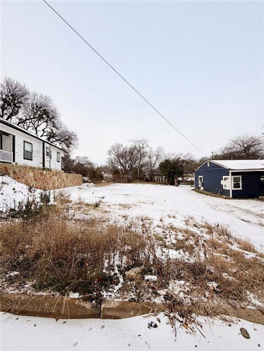 Vacant residential lot in a prime Fort Worth North Side location, offering a great opportunity to build a custom home or develop as an investment property. Situated just minutes from the Stockyards and downtown Fort Worth, this 7,144 sq ft lot provides convenient access to major highways, dining, entertainment, and local attractions. The area continues to see growth and redevelopment, making it an attractive option for builders, investors, or buyers looking to create new construction in a well-located neighborhood. The property is located within the City of Fort Worth Neighborhood Empowerment Zone (NEZ), which may offer potential tax abatements and development-related fee incentives for qualifying projects, subject to city approval. The lot is generally level with utilities available nearby. Buyer to verify zoning, utilities, building requirements, and eligibility for all NEZ incentives.