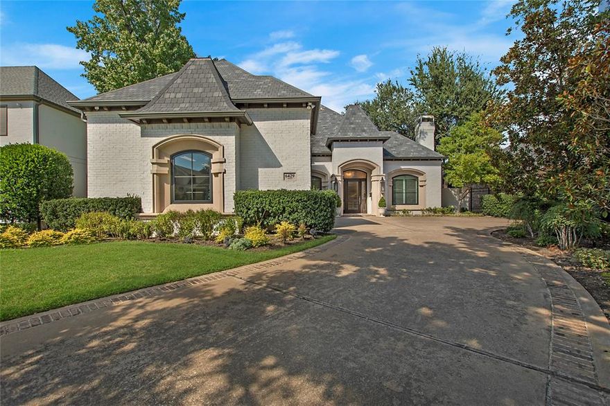 Welcome to this beautifully designed home nestled on a charming tree-lined street in Preston Hollow. As you step inside, you'll be greeted by the grandeur of sweeping ceilings and a stunning spiral staircase, setting an elegant tone for the rest of the residence. The inviting formal dining and living areas, conveniently located just off the entry, are perfect for entertaining guests or enjoying quiet family dinners. The heart of this home shines in the gourmet kitchen, adorned with gorgeous Danby marble countertops and equipped with top-of-the-line Jenn Air commercial appliances. This thoughtfully designed layout features a primary suite and a guest suite on the first floor, providing comfort and privacy for everyone. You'll also find a dedicated office space, ideal for remote work or study, along with a wet bar for easy entertaining. The half bath and a large laundry room with built-ins complete the main level, ensuring functionality meets luxury. Ascend one of the two staircases to discover an expansive game room, a mirrored workout room, and a media room equipped with a projector and screen—your very own private cinema. The second floor also features three additional bedrooms, including one en suite and another with a Jack and Jill bath. Additionally, the home features a spacious three-car garage with beautiful cedar doors.  Outside, the spacious covered patio features an outdoor kitchen with brand new grill and overlooks the sparkling pool. This Preston Hollow gem is a perfect blend of luxury, comfort, and entertainment, ready to welcome you home.