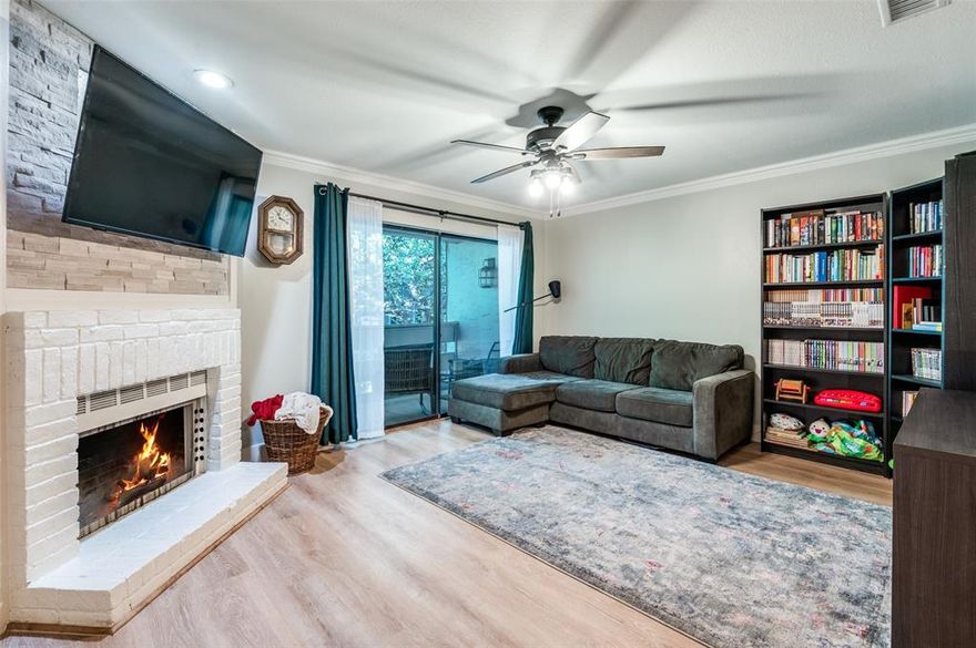 Welcome home to this 2nd floor updated 3-bedroom, 2-bath condo in a prime North Dallas location near Addison! With over 1,200 sq. ft. of living space, this bright and open layout features luxury vinyl plank flooring, a cozy fireplace, and a 55-inch TV that stays, perfect for football games or movie nights by the fire. The kitchen flows easily into the living and dining areas, and the primary suite offers a relaxing soaking tub and separate shower. Enjoy your morning coffee or evening unwind on the back patio overlooking the community pool, complete with extra storage. Reserved covered parking is included, plus water, trash, and roof coverage under the HOA. Easy access to 635, 75, and the Tollway means unbeatable convenience to dining, shopping, and entertainment!
