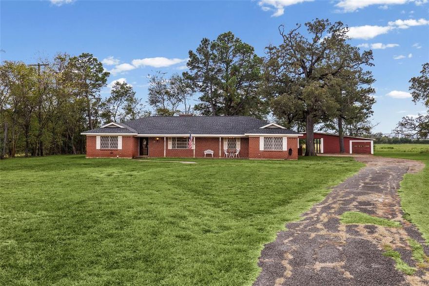 Three bedroom two bath brick home on 1.74 acres.  There are two living areas, eat in kitchen and formal dining area which are all great for entertaining.   The kitchen provides a lot of counter space, a breakfast bar and electric cooktop. Full size laundry area. Spacious bedrooms with master bath having double sinks and guest bath has separate shower.  A delightful sunroom adds the perfect space for relaxing in any type of weather. 
There is a large barn with living quarters  that is perfect for guests, She Shed or Man Cave. And there is plenty of room for storage or extra parking