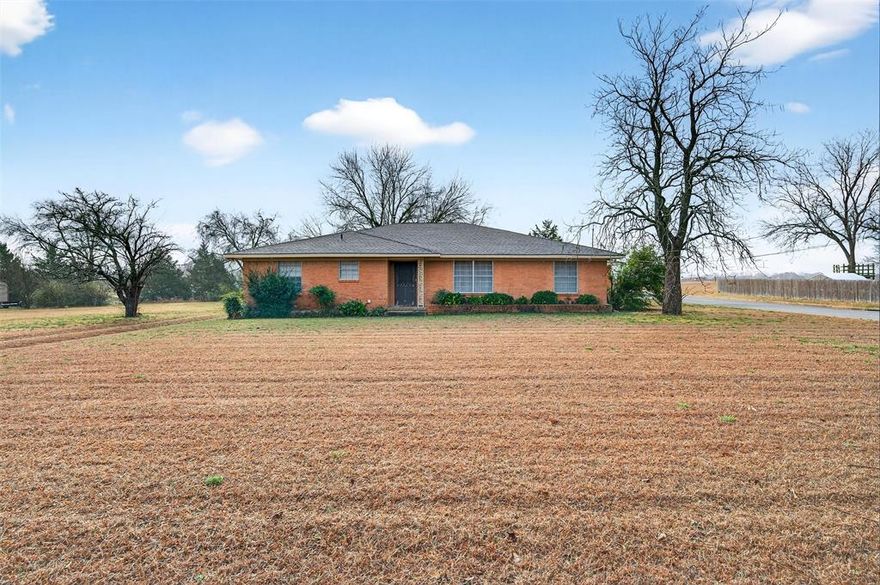 Don't miss out on this incredible opportunity for a spacious home on one acre in Sherman, TX! This 3-bedroom, 2-bath home is full of potential and ready for your renovation touches. Offering generous living space, the layout includes two living rooms and two dining areas—perfect for entertaining or flexible family living. Roof replaced in late summer 2025! Extras include a full-size separate laundry room, loads of storage, and extensive built-in shelving in the living room. Step outside and enjoy peaceful afternoons on the shaded back porch overlooking a full acre of land, providing plenty of room for an additional garage, workshop, or storage building. The existing garage features a workshop complete with built-in shelving and a sink, ideal for hobbyists or extra storage needs. Located in an awesome area just minutes from schools and shopping, this property has so much potential!  Call today for more information.