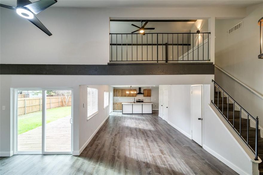 Spectacular, fully remodeled home next to Medical City Plano & just minutes to Baylor Plano, Plano Senior HS & UTD! Enter to find an expansive L-shaped living space with cathedral ceiling & loft living above! The living area to the left has a wbfp, while the space forward is a combination living, dining & kitchen! The kitchen has custom wood cabinets, an oversized island with granite & stainless appliances including an electric range & dishwasher. The  1st floor primary bedroom has a sliding barn door with frosted glass leading to a spectacular ensuite bath with full-view glass shower & vanity with dual sinks. The 2 other guest bedrooms on this level share a fully remodeled bath open to the hall. The 2nd level has a loft living or home office & the 4th bedroom with a beautiful full bath (could be a 2nd primary suite or guest suite). Two sliding glass doors on the 1st level open to the 25-foot wood deck & large fenced backyard! The 2-car garage has a rear entrance & new driveway!