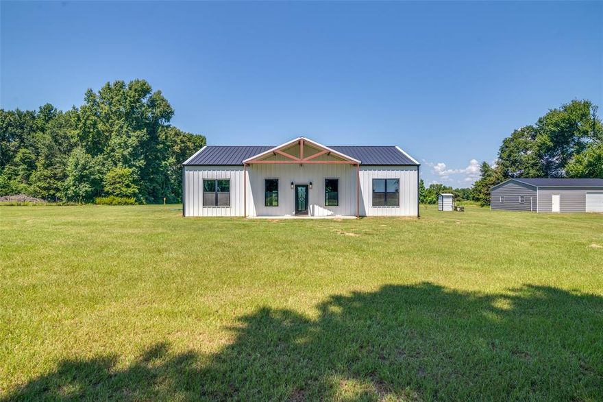 New Construction and completed in 2025, this beautiful modern farmhouse inspired home sits on 4.5 acres, has a a 30x40 detached shop with 2 garage doors and extra space for toys.  As you enter the home, you are greeted with an open concept main living room, LVP wood look flooring, vaulted ceilings, LED lighting, and tons of natural lighting!  The luxury kitchen is equipped with beautiful wood shaker style cabinets, granite countertops, designer lighting, stainless appliances with commercial grade double door refrigerator! Bonus room off the kitchen can be used as a large pantry, office, craft room or a 3rd bedroom! The primary bedroom has a beautiful view of the backyard through the double window, and has a large private bath with gray slate look tile, dual sinks, and large walk in shower! Additional features include ceiling fans in all rooms, laundry room with granite countertop and additional sink, spray foam insulation with double insulated walls, brand new aerobic system, private water well!  The 30x40 shops has 1200 square foot of space to make your own with 2 garage doors to park cars plus additional space for toys or a work shop!