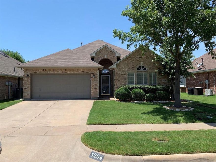 An AMAZING home that has BEAUTY and SECURITY all in one!! This FANTASTIC three bedroom two bath home is located in the highly sought after neighborhood of Shady Valley West in central Arlington. The GATED COMMUNITY includes walking paths and a beautiful green space with a water feature. Starting with major curb appeal, the home also features hardwood floors, granite countertops, stainless steel appliances, crown molding, custom paint, and window coverings throughout. Additionally, the living room offers a cozy gas fireplace, vaulted ceilings, and lots of windows to let in the natural light. The open concept floor plan allows for great entertaining as the kitchen overlooks the living room. The dining area is connected to the gourmet kitchen as well. Privacy is also a key feature in this home as the bedrooms are split with the primary bedroom on one side and the secondary bedrooms on the other side. The backyard is just as impressive with a beautiful covered patio and lush landscaping.