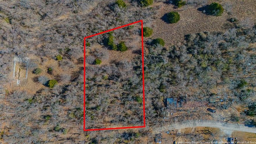 Current owner has been working on clearing the lot some and making it more accessible for buyers. Wooded tract of land with approximately 1.44 acres. Access to Azle city water. Septic system required. Zoned single family residential SF- 4. Minimum 1600 square feet. Barndominiums allowed buy must have 2 garage spaces. No mobile homes allowed. Existing mobiles in the neighborhood are grandfathered in. Current road will have to be extended to reach property. There is some flood plain on the east side of the property. AZLE ISD. Great location close to restaurants and shopping. Easy access off of Jacksboro Highway or 199. Not far from stockyards. Feels like living in the country but not too far away from city life. Dream it, build it, live it here! Beautiful piece of land with major potential. Make this spot your forever home!