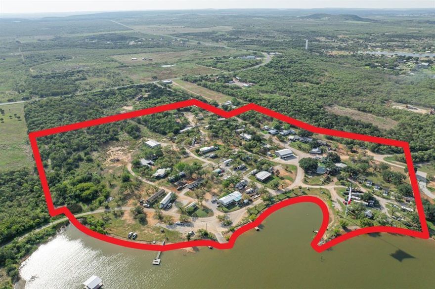 Calling all Developers and or MH RV Community owners! This is a RARE opportunity to acquire a sizable amount of lake front land. These opportunities come up very rarely on the lakes in Texas, and this is also completely deeded (no corps of engineers, no lease back, etc).

JTACR Real Estate Group is pleased to present PK Shores MH & RV Community: a stunning, 84 site, 28 deeded acre destination community located on the beautiful and highly sought after Possum Kingdom Lake. The community features 11 cabins, 31 long term RV sites, 30 tenant owned MH sites, 12 weekend RV sites, a fully stocked convenience store, a $1m resort style pool, coin operated laundry, a newly renovated boat ramp, fish cleaning station, boat docks, a community and event center, and much more. With its variety of amenities, PK Shores MH and RV Resort has become a local favorite. Owners cater to the community by selling season passes for the pool, daily passes for the pool, sponsoring local events and charities, honor system use of the boat ramp, and free coffee inside the main office.
Advantageously positioned on Possum Kingdom Lake, this property boasts the most lake frontage owned by a private 
entity on the ENTIRE lake.