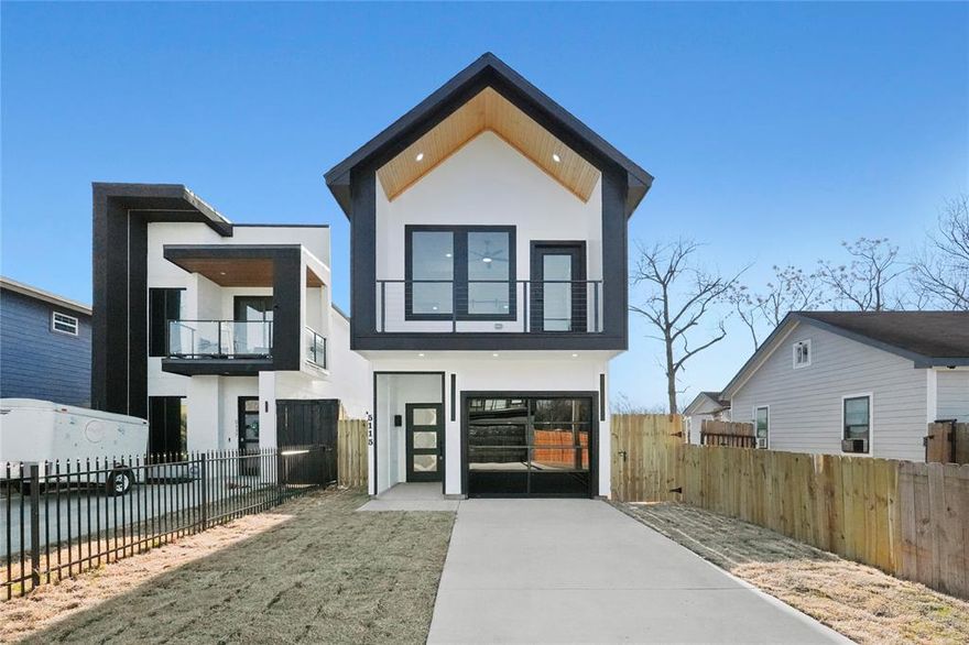 Discover modern comfort and style in this stunning 2026 new-construction home, thoughtfully designed with an open-concept layout and contemporary finishes throughout. The main living area features an inviting electric fireplace and ceiling fan, seamlessly flowing into a sleek kitchen equipped with a spacious island, electric range, built-in microwave, and dishwasher, perfect for both everyday living and entertaining. Sliding glass doors just off the living space lead to a generously sized backyard, offering plenty of room to relax, host gatherings, or create your ideal outdoor retreat. Upstairs, the private primary suite serves as a true sanctuary, complete with its own electric fireplace, ceiling fan, and a balcony — the perfect spot to unwind and take in the surrounding views. The luxurious en-suite bath showcases a double vanity, walk-in shower, and expansive walk-in closet. Two additional bedrooms and a full bath provide comfortable space for family, guests, or a home office. Ideally located with convenient access to major highways, shopping, dining, and entertainment destinations throughout Dallas, this home offers the perfect blend of modern living and city accessibility.