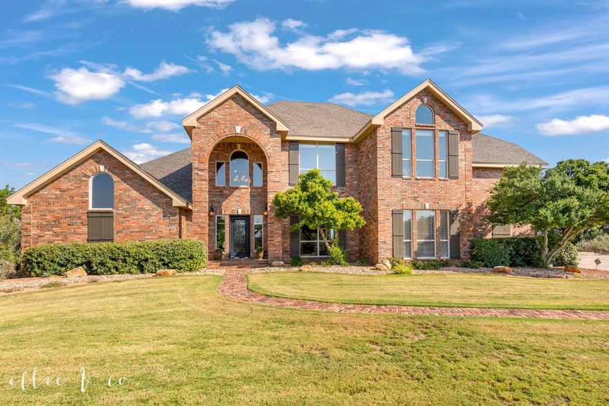 The views from this property are spectacular!  A must SEE at any time of the day, sunrise, sunset, and under the night sky with city lights in the distance.  Beautiful views and natural light from inside with well appointed windows thru out.  Stunning 44-acre luxury one owner estate just minutes from Abilene. This custom home offers 3 bedrooms, 2.5 baths, soaring ceilings, transom windows, 3 indoor fireplaces, terracotta tile and wood flooring, spacious dining and living areas. Step down from the grand foyer into the primary suite showcasing a window seat view, its own fireplace with gas logs, ensuite bath with dual sinks, granite counters, garden tub, and custom walk-in closet. A formal dining room flows from the entry to the kitchen. A stained wood staircase adorned with metal leads to an upstairs landing flanked by a living room to the left and two bedrooms to the right.  A corner stone wood burning fireplace, wood floors, and the best seat in the house are exhibited in the upstairs living. A 308 sq ft unfinished room could be completed for a fourth bedroom, or great for storage!  The downstairs living boasts a wall of gorgeous built ins offering a fireplace with gas logs. A breakfast nook is picture perfect aside a breakfast bar looking into a dreamy kitchen with white cabinets and an arched whitewashed brick surround for the stainless appliances and smooth cooktop. Outdoor amenities feature a sparkling pool, outdoor kitchen, fire pit, covered patios, and a grand stone fireplace with panoramic views of sunsets, hills, and the Abilene skyline. The land includes a large stocked tank with bass, abundant wildlife, trails, space for livestock and your ATV adventures. Landscaped with sprinkler system, gated entry, and 2-car side entry garage. Rare opportunity to enjoy secluded luxury living plus an outdoor lifestyle, and convenience just outside city limits, Jim Ned ISD.