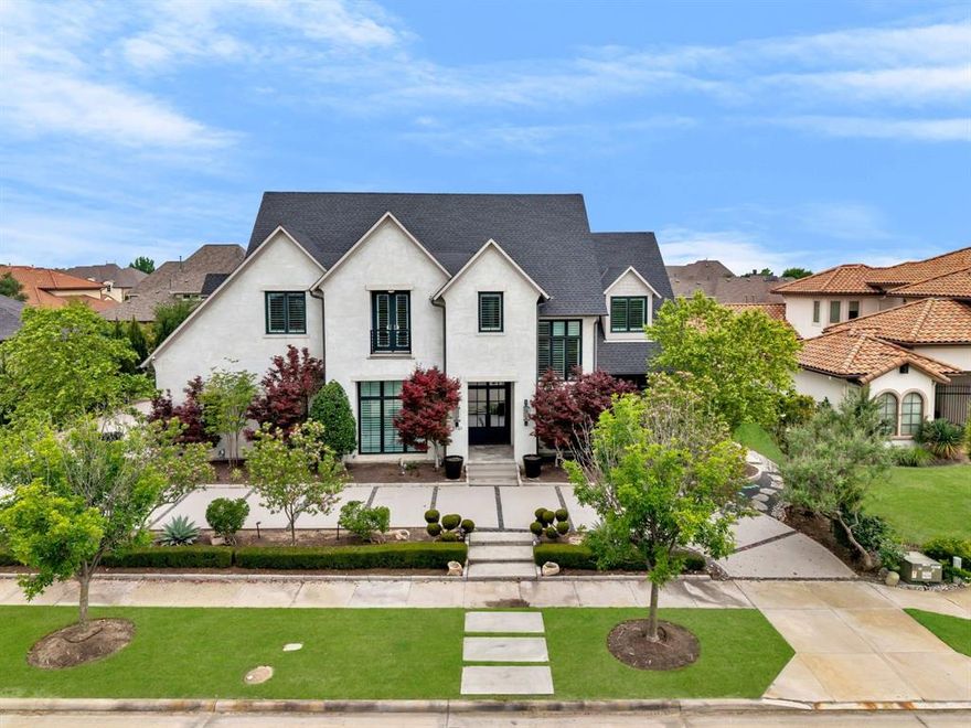 Breathtaking custom home with SIX bedrooms and incredible resort-style backyard in Frisco's most desirable guard-gated neighborhood! Gorgeous German-schmear brick exterior and a circle drive nestled in lush landscaping lead to an oversized front porch with stately, double iron and glass doors. The large foyer features a stunning RH chandelier hanging from a soaring ceiling with views of the staircase up to the second floor and straight through to the backyard! A huge study is well-appointed with designer built-ins, high ceilings and a large closet. The dining room has beautiful lighting, large windows and leads to the fabulous wine bar on the way to the kitchen! The dreamy kitchen features a large, breakfast bar island, tons of cabinets with hidden hinges and custom pull-outs, two dishwashers, gas stove and SubZero fridge. Ideally open to the spacious family room and the breakfast nook tucked in a corner of windows - all boasting fabulous backyard views! The family room benefits from an oversized fireplace surrounded by shelving on both sides, plenty room for a crowd and doors to the pool. The private master bedroom is a stunning retreat with a windowed sitting area and a spa-like luxury bath featuring separate vanities, true makeup vanity, jetted tub and large walk-in shower plus a huge custom closet! Another downstairs bedroom is ultra private at the front of the home w ensuite bath. A large downstairs flex space is an ideal media room w custom black-out shade. Upstairs is a huge home gym complete with lockers, a game room and four roomy bedrooms, two with renovated ensuite baths, two share a beautiful jack-n-jill bath with pocket doors and separate walk-in closets! An upstairs balcony is a cozy spot overlooking the backyard! The outdoors is a true retreat with multiple covered patios, a large fireplace, well-equipped outdoor kitchen & a huge diving pool and turfed yard! Loads of upgrades like new carpet throughout, upgraded security and fresh paint throughout.