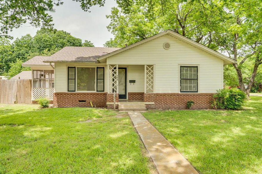 Set on a large corner lot surrounded by mature trees, this 2-bedroom, 1-bath home in Ennis offers a rare sense established character. Located within walking distance to St. John’s Catholic Church. Inside, hardwood floors bring warmth and character throughout, complemented by fresh interior paint for a clean, move-in ready feel. Both bedrooms are generously sized, offering comfortable living space that stands out for the age and style of the home. A recently installed HVAC system adds important efficiency and peace of mind. Outside, the property continues to deliver. An approximately 440 sq ft detached garage with overhead door provides excellent storage, workshop potential, or hobby space. The lot extends beyond the wood privacy fence, offering more usable land than immediately visible.