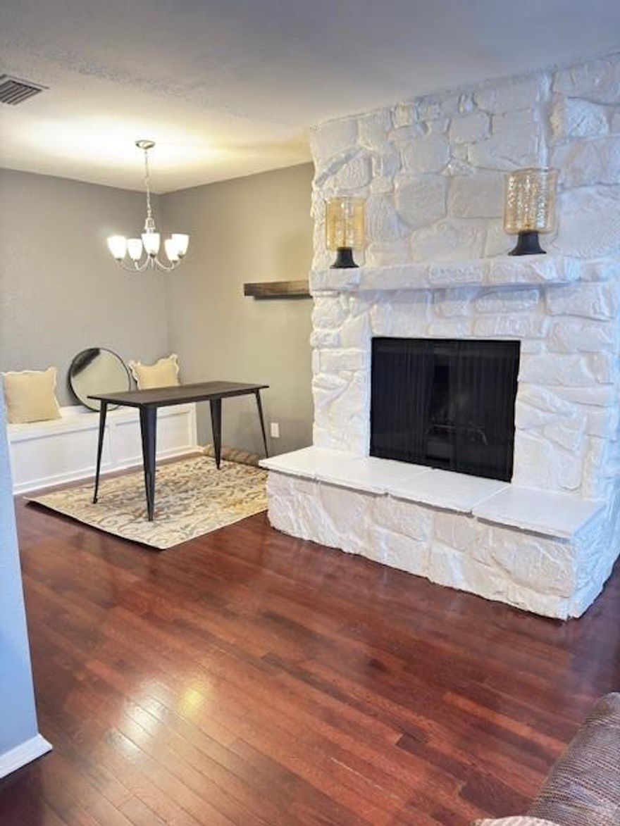 Great charming house for 1st time buyer!! Located minutes from major freeways. Harwood floors throughout Living room and dining area, kitchen and bedrooms have laminate flooring. Wood burning fireplace and lighting fixtures throughout. Eat in kitchen with marble countertops. Large primary bedroom with walk-in closet and ensuite. Gated area for vehicles comes with 2 Covered Carports & Gorgeous fenced in Patio. Enjoy the two pools & Club house! Location, Location, Location.. right off 635 & 75, 15 minutes from Downtown, Galleria & tollway. Schedule your showing today.