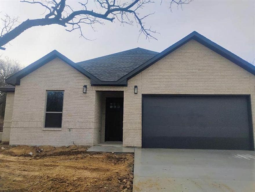 New construction 3 bedroom, 2 bath, 2 car garage home with many custom features you typically don't see in this price range.  Full foam insulation, vaulted ceiling in living room with wooden beam, brick fireplace, LVP flooring, large walk-in shower in master bathroom.  Open floor plan with large living area, kitchen and dining room.   The lot backs up to a greenbelt so there won't be any neighbors behind the house.