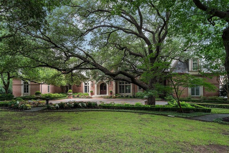 Comfortable, classic French living in the heart of Dallas. This Robbie Fusch masterpiece, built by Randy Hughes, is more than 14,000 sq ft of gracious spaces that flow with ease across 3.38 private acres. Six ensuite bedrooms, including attached quarters with a living area, offer comfort for family and guests alike. Walls of windows fill rooms with light and connect every gathering to the idyllic grounds. Movie nights become cinematic in the 20-seat soundproof theater, and wine lovers can savor their 750+ bottle cellar. A 2,500 sq ft pavilion with catering kitchen is perfect for dinners under the stars or lively celebrations. Thoughtfully designed for both everyday moments and once-in-a-lifetime occasions, this estate balances beauty, privacy, and livability — the ultimate Dallas retreat.