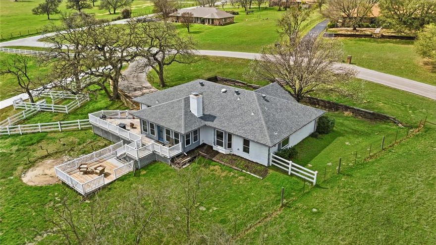 Charming country property in Kelly View Estates on 2.3 Acres.  Enjoy peaceful country living in this 3-bedroom, 2-bath home situated on a desirable corner. This property offers the perfect blend of comfort, functionality, and space for both everyday living and hobbies.  The home features a vaulted ceiling with beautiful new windows installed within the last two years, bringing in abundant natural light and improved energy efficiency. Off the living room is a nicely enclosed patio with air conditioning that provides a comfortable year-round space for an office or to relax or entertain while overlooking the acreage. Step outside to a tiered backyard decking area, perfect for outdoor gatherings, cooking and dining, or simply enjoying the quiet surroundings. The property is cross-fenced and primarily enclosed with attractive white vinyl fencing, adding both durability and curb appeal while making it ideal for horses. Equestrian amenities include a 24x30 metal barn, sheltered loafing area, electricity, water.  For those needing workspace or storage, the property also includes a new 30x40 shop with electricity, plus a 30-foot overhang for additional covered parking for equipment, trailers, or recreational vehicles.  With its combination of acreage, functional improvements, and comfortable living spaces, this property offers a rare opportunity to enjoy country living with room to work, play, and relax.  New HW heater, water softener with triple osmosis and range installed within last two years.  Garage has a workbench and cabinets. Property is located in the city limits with city utilities.  More photos coming