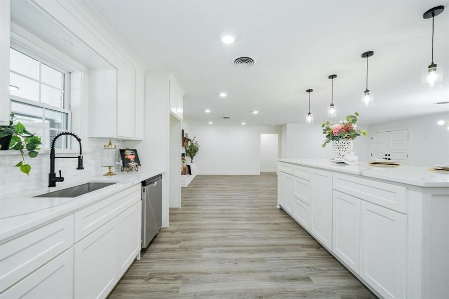 Welcome to this beautifully updated four-bedroom, two-bathroom home located in the sought-after Wedgewood neighborhood. As you approach, you'll be greeted by an inviting front porch and beautiful double doors. Step inside and discover an open-concept floor plan seamlessly connecting the entryway, living room, formal living, dining area, and kitchen. The living room features a cozy fireplace and double doors that open to a spacious sunroom. The dream kitchen boosts a large island with built-in cabinets, a farmhouse sink, quartz countertops, and ample storage, including a generous built-in pantry. The kitchen flows into the breakfast area, highlighted by a bay window which brings in lots of natural light. The laundry room offers built-in cabinets, abundant storage, and convenient backyard access. The main bedroom includes a walk-in closet and an en-suite bathroom with a stand-up shower and quartz countertops. The three additional bedrooms are all great size with large closets. The backyard offers a shaded area with large oak trees, a wood fence for privacy, and a good-sized pool with space for a diving board.   Highlights of this home include luxury vinyl flooring throughout, ceiling fans in all bedrooms, recessed LED lighting, decorative lighting in the dining area, fresh paint, quartz countertops, built-in cabinets in the kitchen and bathrooms, and recently installed garage door openers. New electrical and cast iron plumbing has also been replaced. Roof is 3 years old.  Buyer and buyer's agent to verify school information, measurements and information.