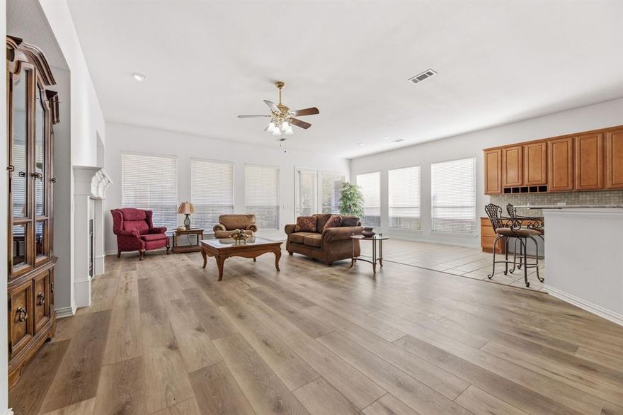 NEW LVP FLOORING!!!! NO CARPET. STATELY STONE & BRICK HOME - HIDDEN VALUE IN HERITAGE RANCH: DFW's PREMIER GATED COMMUNITY FOR THOSE 50+, SPACIOUS 1 STORY HOME-BRING YOUR LARGE FURNITURE - TASTEFULLY LANDSCAPED-FENCED BACKYARD, OVERSIZED GARAGE with GOLF CART AREA, 2BR, 2BA, STUDY, LARGE COVERED PATIO with PRIVACY LANDSCAPING. FEATURES: LVP Flooring, Ceramic Tile, No Carpet, Spacious Great Room-Open Design, 8' Front Door with Transom, French Door Study, Fresh Paint, 10' Ceilings, Extended Breakfast Nook, Gas Fireplace, Large Media Niches, Upgraded Light Fixtures, Art Niche, Comfort Height Commodes. GOURMET KITCHEN: Granite Counters, Gas Cooktop, Granite Topped Island with Electricity, Updated Tile Backsplash, Pullout Drawers-lower cabinets. EXPANSIVE PRIMARY SUITE: Spacious with Sitting Area, Separate Shower, 2 Walk-in-Closets, Dual Vanities-one Sit-down Vanity, Linen Closet. OTHER: Gas Plumbed for Grilling, Roof (2014), Two Separate HVAC- AC Coils (2015 & 2022), WH (2018). ENJOY THE HERITAGE RANCH LIFESTYLE: Resort-style Amenities, Clubhouse, Two Restaurants, Indoor & Outdoor Pools, Fitness Center, Stage, Dance Floor, Pickleball, Tennis, Walking Trails & a myriad of Events, Clubs & Activities.