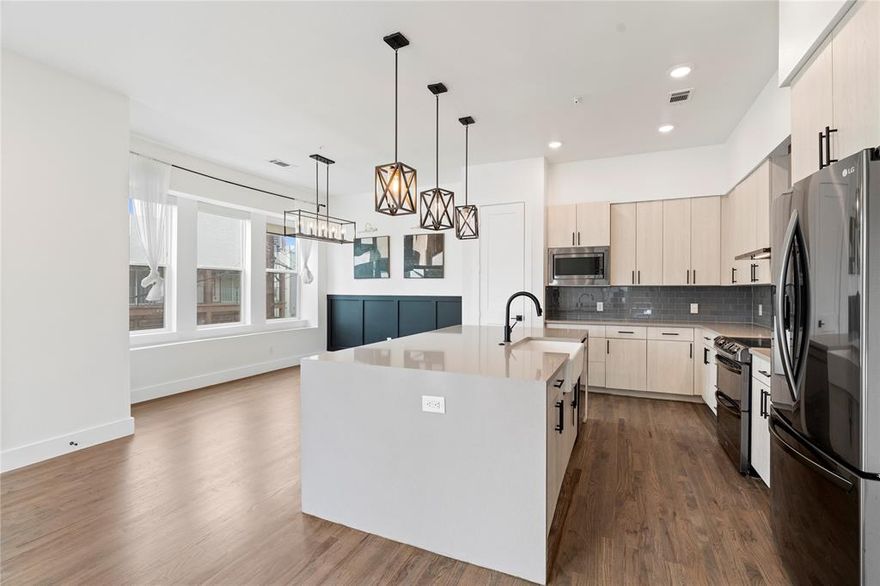 Unobstructed views of the downtown skyline, a private rooftop terrace, and walkability to everything from coffee shops to nightlife, this home delivers the ultimate urban lifestyle.Experience vibrant city living in this sleek and sophisticated corner-unit townhome, ideally located in the heart of East Dallas. Built in 2021, this 3-story residence offers 2 bedrooms, 2.5 bathrooms, and 1,800 square feet of thoughtfully designed living space. The open-concept layout on the main floor features wide-plank hardwood floors, soaring ceilings, and oversized windows that flood the space with natural light. The chef’s kitchen is outfitted with stone countertops, a large island, custom cabinetry, and premium appliances—perfect for hosting or winding down with city views in the background.Both bedrooms are spacious with private ensuite baths, and shades throughout the home provide convenience and privacy. A striking spiral staircase leads you to an impressive private rooftop deck, your personal retreat for entertaining, it allows for even more outdoor space for dining under the stars, or just soaking in panoramic skyline views.