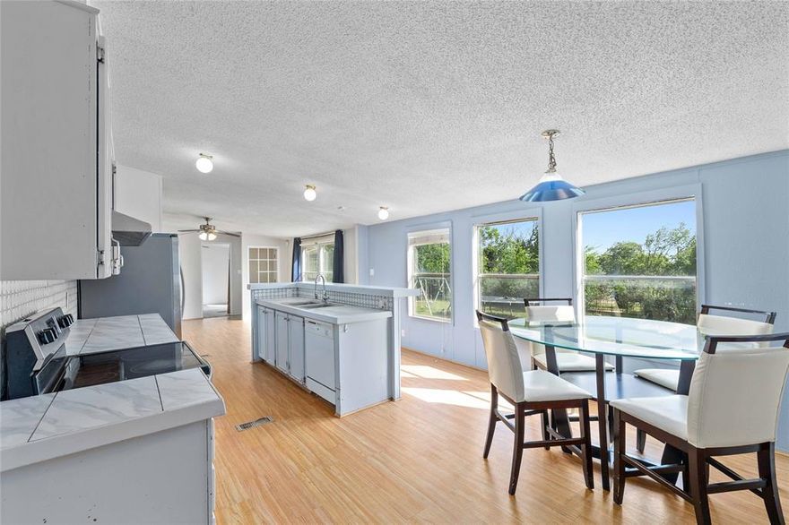 Discover the perfect blend of comfort and versatility in this charming three-bedroom, two-bath doublewide home, situated on a sprawling 0.69 acres across three beautifully landscaped lots. This property offers an exceptional lifestyle with ample space for relaxation and entertaining.

Step inside to find a bright and inviting living area that seamlessly connects to a well-equipped kitchen, making it ideal for gatherings and culinary adventures. The three spacious bedrooms provide a serene retreat, while the two bathrooms offer convenience and privacy.

One of the standout features of this property is the expansive large shop, which presents a multitude of possibilities. Whether you envision it as a second living quarter for guests, a creative workspace, or a hobbyist's dream, the potential is limitless. 

Beyond the main home and shop, you'll find several additional structures, including practical sheds for storage and raised garden beds that invite you to cultivate your own vegetable and flower gardens. The covered patio is the perfect spot to unwind and take in the breathtaking views of the Santa Anna Mountain, making it an ideal space for outdoor entertaining or quiet reflection.

With its combination of spacious living, additional structures, and stunning natural scenery, this property is a rare gem waiting for you to call it home. Don’t miss the opportunity to experience the charm and beauty of this unique offering!