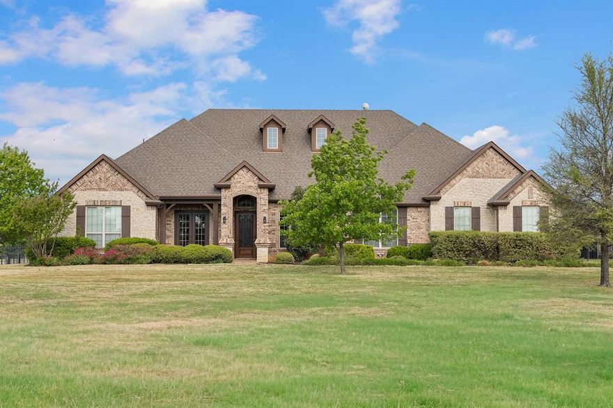 Experience refined luxury and effortless comfort in this stunning single-story estate, perfectly designed for both everyday living and upscale entertaining. Featuring 4 spacious bedrooms and 3 full bath - including a convenient Jack-and-Jill layout-plus 2 additional half baths-one with direct pool access, this home offers an ideal blend of functionality and elegance. The thoughtfully designed floor plan also includes a private bedroom and bathroom suite, perfect for multigenerational living or accommodating long-term guests. Step inside to discover hand-scraped hardwood floors, fresh interior paint, and brand-new carpet, creating a crisp, move-in ready feel throughout. The open-concept design is filled with natural light, while the gourmet kitchen is a chef's dream, showcasing stainless steel appliances, granite countertops, and ample space for gathering.  The resort-style backyard is truly exceptional-complete with a saltwater pool, relaxing jacuzzi, tanning deck, and tranquil waterfall. Entertain year-round with an outdoor kitchen area, cozy fireplace, and inviting fire pit, all designed to create unforgettable moments or a Fantastic Staycation! Additional highlights include a dedicated media room, spacious game room, EV charging station wiring, and oversized parking for added convenience. Tucked away in a peaceful, secluded setting, this property offers the perfect balance of privacy and accessibility-just minutes from shopping, dining, and everyday essentials.  Luxury, comfort, and lifestyle come together seamlessly in this extraordinary home.