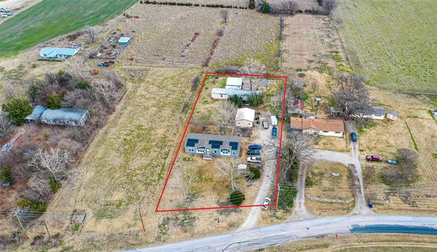 Don’t miss this opportunity to own a versatile property situated on nearly an acre in a quiet, peaceful neighborhood, perfect for those seeking space, privacy, and room for animals, including horses. This unique property features two homes, offering flexibility for multi-generational living, guests, or rental potential. The main home offers 3 bed and 2 bath and is ready for your personal touch, with standout features including an open floor plan and a spacious primary suite with a private bath and large soaking tub.
The accessory unit is beautifully designed 2021 model with an open, bright layout, 4 bed and 2 bath low-maintenance vinyl flooring for a modern feel. You’ll enjoy cooking in the spacious kitchen, complete with a large island, abundant cabinetry, built-in storage, and granite countertops. The primary suite in the accessory unit includes a generous ensuite bath with a walk-in closet, dual sinks, an oversized vanity with ample storage, and a large walk-in shower.
Additional highlights include a storm shelter, generator hookups for the main home, garage, and workshop, and plenty of room for RVs and outdoor equipment. Conveniently located near the lake and close to RV parks and campgrounds, this property offers the perfect blend of country living and recreational access. This is a rare opportunity to enjoy space, functionality, and endless possibilities in a serene setting.