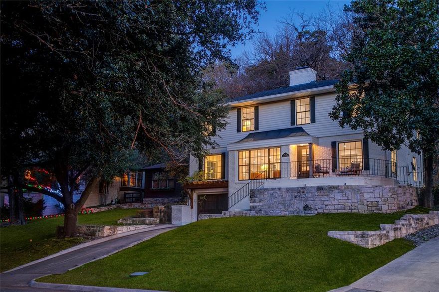 Perched above the fairway, this Kessler Park home lives in quiet conversation with Stevens Park Golf Course. Mornings unfold gently, filtered light through mature trees, walkers and joggers tracing the greens, the neighborhood moving at an easy, familiar pace. Inside, the sense of scale is immediate. High ceilings and expansive rooms create openness without excess, while hardwood floors carry warmth through both levels. Natural light shifts throughout the day, giving each space its own rhythm and calm. The kitchen is grounded and refined, anchored by marble surfaces, professional-grade appliances, and thoughtful storage. It’s a space designed for real life, where meals are unforced and time stretches naturally from counter to table. The layout flows seamlessly into the main living areas, supporting both everyday living and quieter moments at home. Upstairs, the primary suite offers true separation and ease. Generous proportions, treetop views, and a feeling of privacy create a place to settle in and recharge. The finished basement adds flexibility, easily accommodating a media room, studio, fitness space, or guest retreat. Outside, stone terraces and a private patio nestle into the landscape. Evenings linger as the light softens, the course grows still, and the city fades to a low hum. An oversized garage adds everyday practicality, while the location quietly does the rest. One of only a handful of homes facing the newly renovated Stevens Park Golf Course, it sits moments from Coombs Creek Trail, Bishop Arts, and the cultural energy of Oak Cliff, with downtown Dallas close enough to feel accessible, yet distant enough to fade away. This is a home shaped by its surroundings and elevated by intention. A comprehensive down-to-the-studs renovation was completed in 2019, with a detailed upgrades list available outlining the full scope of improvements.