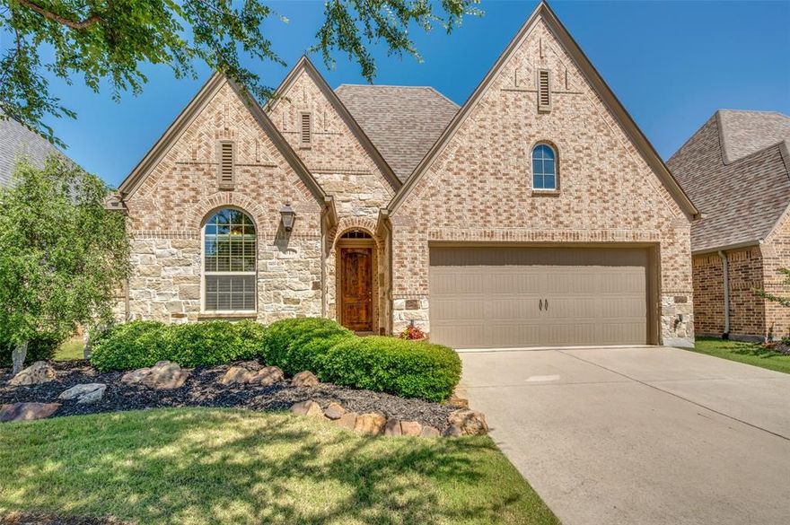 Step inside this beautifully designed home where elegance and functionality merge seamlessly.  With 3 bedrooms, 2 full baths, office, media room and a 2 car garage, this residence offers an impressive array of builder upgrades and expansive interiors all nestled in the sought after community of Trinity Falls. As you step inside, this stylish open floor plan the beautiful hardwood floors lead you into the lavish kitchen featuring an abundance of cabinets and counter space with silestone countertops and upgraded brushed nickel throughout the home and a huge island with ample seating for family and guests. Additionally there is a gas cooktop and built-in appliances as well as a walk-in pantry. The kitchen flows into the light and bright breakfast nook overlooking the spacious family room where there's a beautiful stone fireplace with gas logs that becomes the centerpiece for relaxation and entertaining.  The primary bedroom is split from the others and features a sitting area and luxurious ensuite bath with dual sinks, garden tub, separate shower and large walk-in closet.  There is a dedicated office with beautiful glass doors and a separate media room. The laundry room is oversized and features extra storage space. Step outside to find an extended covered patio, beautiful stone and wood fencing for privacy and full sprinkler system.  The spacious 2 car garage includes painted flooring, garage opener, pull down attic storage and a tankless hot water heater for instant hot water for the home. Enjoy acres of green space, resort style pools, splash pads, playgrounds, dog park and access to nature trails and more. Seller is offering a 1 year American Homes Shield warranty for buyers with an acceptable offer.