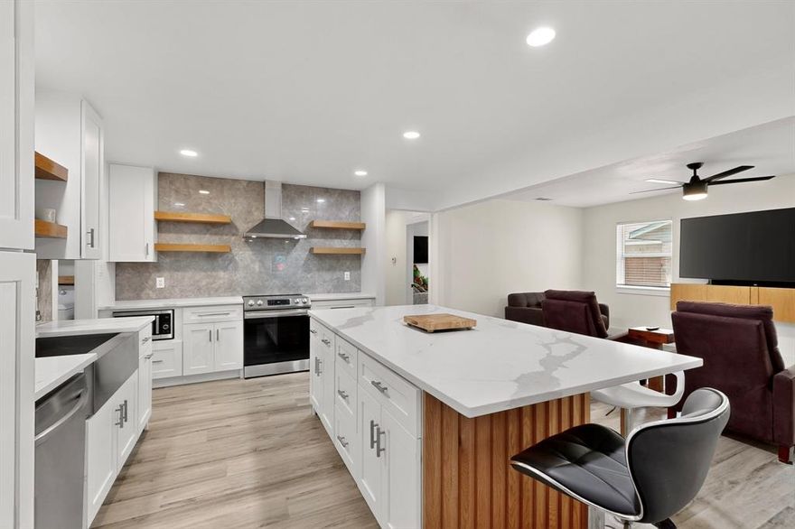 Step inside this beautifully renovated 3 bedroom, 2 full bath home featuring an open concept plan perfect for modern living. The brand new roof offers peace of mind, while the gourmet kitchen boasts an oversized island, sleek countertops, and abundant cabinetry- a true cook's delight. The spacious living area flow seamlessly, creating an inviting atmosphere for entertaining. Both bathrooms are tastefully updated with stylish fixtures and finishes. With fresh Luxury Vinyl Plank flooring throughout the house, updated lighting, and contemporary design, this home is truly move-in ready. Schedule a showing today.