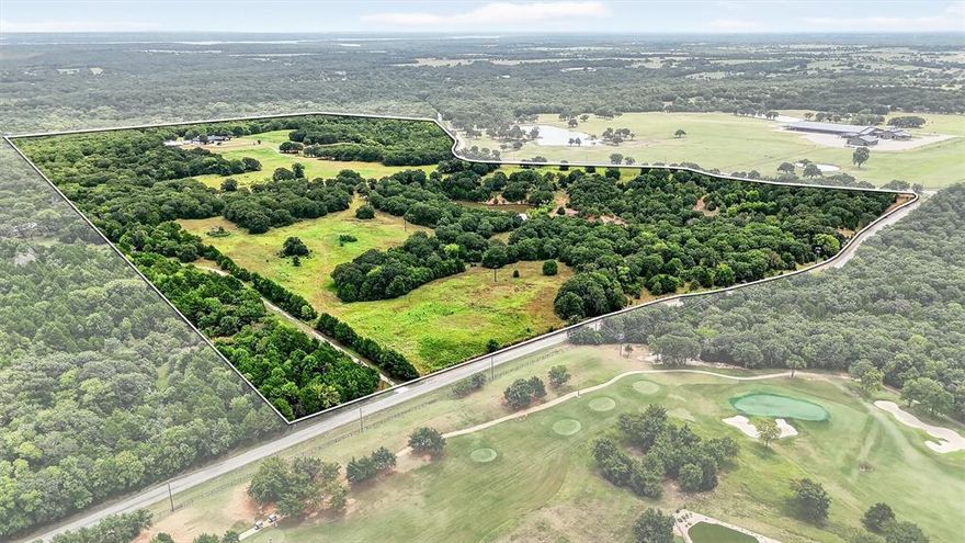 First time on the market in over 40 years, this incredible 92± acre property offers endless possibilities—perfect for a private ranch, event venue, or future development. Framed by rolling hills and native oaks, it sits at Rock Creek & Liberty Rd, just minutes from Lake Texoma and Rock Creek Resort. The property is fully fenced with pipe fencing, backs to Corps land, and features paved frontage, 3 water wells, 2 ponds, and an 80x40 shop with full kitchen and bath. At its heart is a custom 5,000± sq ft home with 5-car garage, designed for both comfort and function.