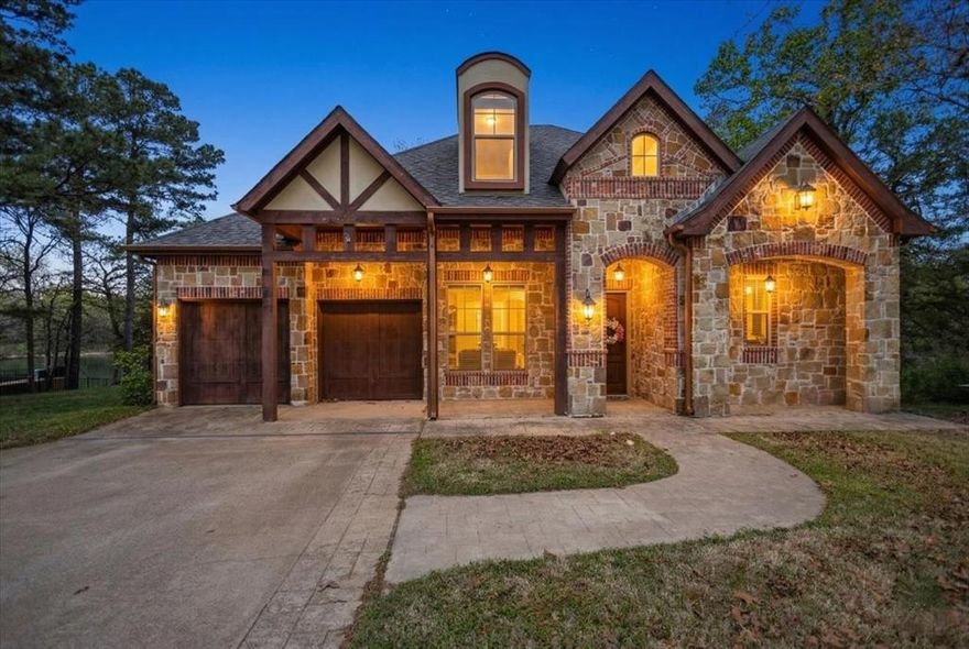 Waterfront Luxury in The Cascades Golf Club!  Nestled in the prestigious Cascades Golf Club in Tyler, TX, this exceptional waterfront home offers refined design, scenic views, and a highly functional multi-level layout. Situated on a quiet cul-de-sac, this 3-bedroom, 3 full bath, 2 half-bath residence delivers privacy, elegance, and comfort in one of East Texas’ most desirable communities.  Inside, expansive windows, soaring ceilings, and rich hardwood floors create a light-filled, inviting atmosphere. The home has been professionally styled by The Feathered Nest Design and curated with WAGS, enhancing its cohesive and elevated presentation.  The gourmet kitchen is designed for both everyday living and entertaining, featuring a Sub-Zero refrigerator, commercial-grade double oven, and 8-burner gas range, along with custom cabinetry and premium finishes.  The main level features a private primary suite with a spa-inspired en-suite bath, along with a dedicated office, ideal for remote work or a quiet study space. Upstairs includes a spacious bedroom with en-suite, while the lower level offers a second living area, bedroom with en-suite, and powder bath, ideal for guests or multi-generational living.  Outdoor living spans two levels, with a stone-paved patio below and a covered deck above, both with ceiling fans and positioned to capture peaceful water views and East Texas sunsets.  Additional features include a detached 1-car garage with private-entry casita, perfect for guest quarters or a second home office, plus a 2-car attached garage, and central HVAC with gas heat.  Located in The Cascades, one of Tyler’s premier golf course communities, residents enjoy access to a lifestyle defined by scenic surroundings, luxury homes, and proximity to top-tier dining, medical facilities, and retail. This property represents a rare opportunity to own a waterfront home in Tyler, TX that combines elegance, functionality, and location.