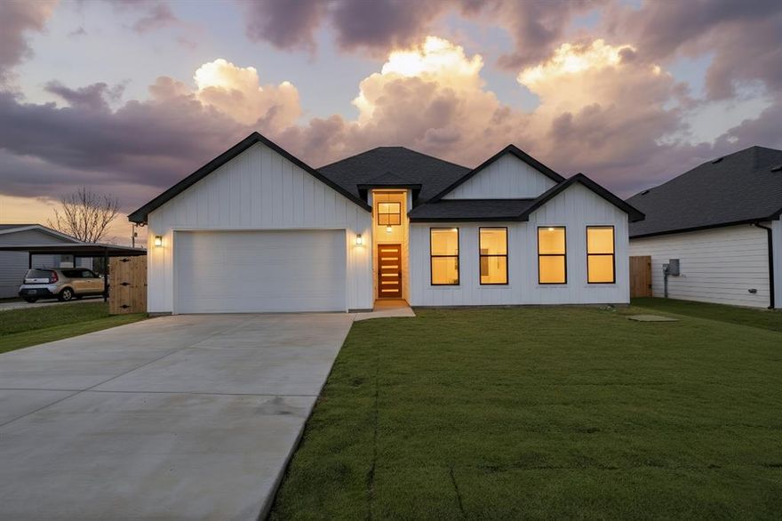Welcome to this beautifully crafted brand-new 4-bedroom, 2-bathroom home in Granbury, Texas, designed with modern finishes and an open layout that makes everyday living feel effortless. From the moment you walk in, you’ll appreciate the seamless flow and thoughtful details that make this home both functional and inviting.
The spacious living area opens directly into a show-stopping kitchen built for gathering. An L-shaped island anchors the space, offering abundant prep room and seating. Dark granite countertops add depth and contrast, while stainless steel appliances—including an electric range, microwave, and dishwasher—complete the clean, contemporary look. Whether you’re hosting friends or enjoying a quiet night in, this open floorplan delivers the perfect setting.
The private primary suite brings comfort and relaxation. It features a large walk-in closet and an ensuite bathroom with dual sinks, dark granite counters, and a sleek glass-encased shower. Three additional bedrooms provide flexibility for guests, family, or a home office, and the second bathroom continues the cohesive design with matching dark granite finishes.
Outside, you’ll find a large fenced backyard with a covered porch—ideal for outdoor dining, entertaining, or simply enjoying the Texas evenings. The built-in sprinkler system helps keep your lawn looking its best year-round. A two-car garage adds convenience and extra storage.
Located in the highly desirable Canyon Creek subdivision, you’ll enjoy access to a guarded security gate, community clubhouse, swimming pool, fishing pier, tennis courts, and multiple boat ramps. This amenity-rich community offers a lifestyle that goes beyond just a home—all just minutes from the charm, dining, and shopping in Granbury.