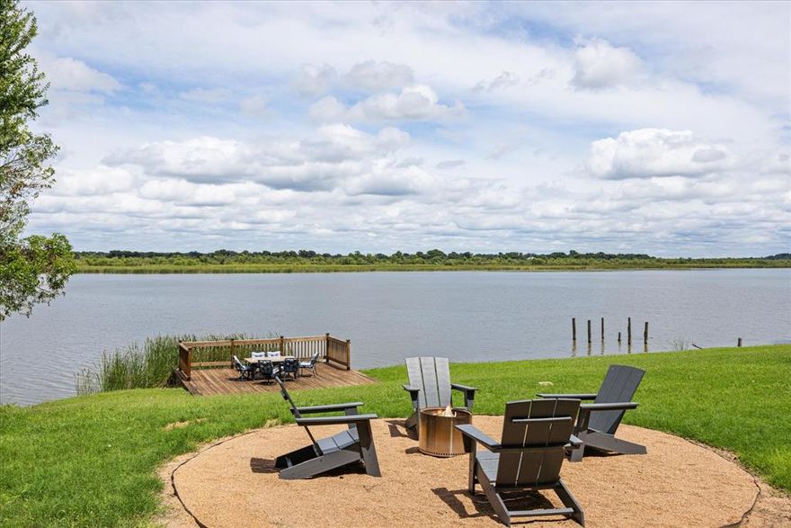 Don't miss this rare opportunity to own a fully renovated, turnkey lakefront retreat with 500 feet of private water
frontage and a private boat ramp. It's perfect for short-term rental income or your personal getaway. This charming
lake house was fully renovated and offers 3 beds, 1 bath, and a modern full kitchen with oversized island. Enjoy
expansive lake views from the 800 sqft deck with pergola, perfect for entertaining and relaxing by the fire pit. The
property spans 2.5 acres across 5 platted, cleared lots, offering both space and potential for expansion. Utilities and
infrastructure are in place with a large septic system with lift station, 2 electrical services, and 2 water wells. Partial
irrigation is sourced from the lake. Property is offered fully furnished, including full size washer and dryer, kitchen
appliances, canoes, loungers, and outdoor essentials, this is a ready-made Airbnb investment or private lakeside
escape.