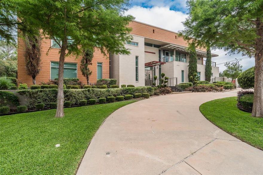 This stunning contemporary home sits gracefully on a prominent corner lot, offering a striking modern design that thoughtfully separates everyday living from entertainment. Bedrooms are tucked privately on one side of the home, while the chef-inspired kitchen and expansive living areas flow together on the other. The kitchen showcases elegant pendant lighting, Viking appliances, and clear views of the backyard oasis. Warm interior tones, recessed lighting, tall ceilings, and floor-to-ceiling windows in the living room create a bright, inviting atmosphere, enhanced by a large built-in aquarium perfect for Nemo and all his fish friends. The living room’s breathtaking window wall frames spectacular views of the resort-style pool, which can also be enjoyed from the kitchen, dining room, primary suite, and the dramatic catwalk balcony. The second floor is an entertainer’s dream, ideal for sports lovers and movie enthusiasts alike. It features a true movie-style media room, a spacious gameroom, and a large wet bar with an elongated serving counter—perfect for hosting game nights, watch parties, or relaxed gatherings. From this upper level, guests enjoy direct access to the balcony overlooking the resort pool, creating a seamless indoor–outdoor experience. Outside, the home transforms into a private paradise with an outdoor kitchen, sparkling pool with a waterfall and hot tub, relaxing cabanas, a putting green, and a spiral staircase leading effortlessly to the upstairs balcony. The primary bedroom offers a luxurious retreat with a tray ceiling, cozy fireplace, walk-in closet, private patio, and tranquil pool views, while additional bedrooms provide generous space, walk-in closets, and ensuite bathrooms. Completing this exceptional property is a spacious 4-car garage with ample room for vehicles, tools, and storage—making this modern masterpiece as functional as it is beautiful.